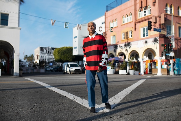 Portrait of young man posing in the city