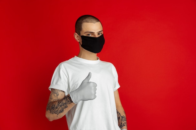 Free photo portrait of young man on red background