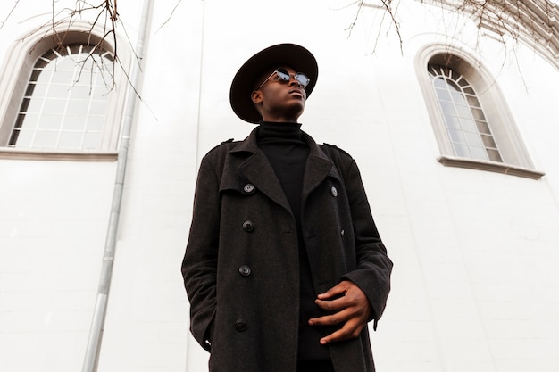 Portrait of young man with hat and sunglasses