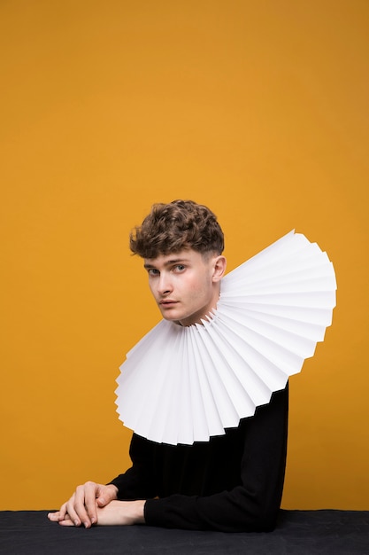 Portrait of young man with ruff in a yellow scene