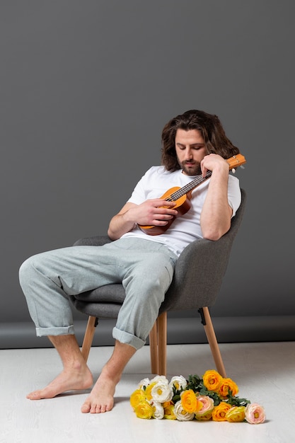 Portrait young man with ukulele