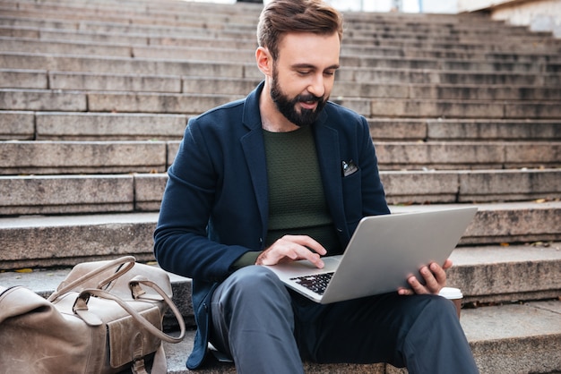 Portrait of a young man working on laptop