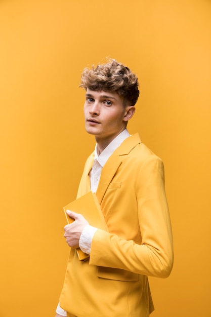 Free photo portrait of a young man in a yellow scene