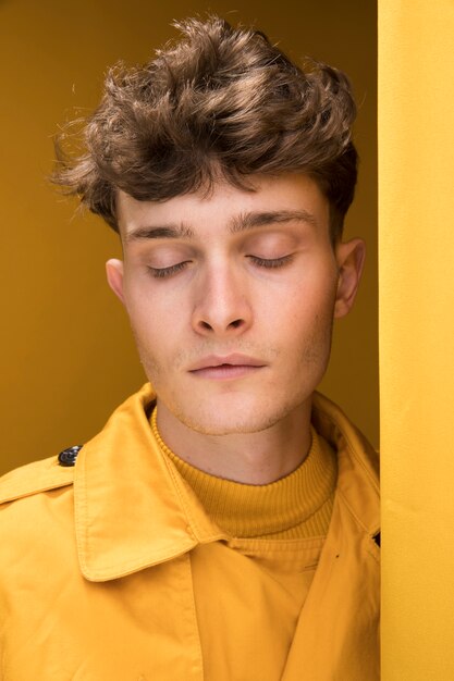 Portrait of a young man in a yellow scene