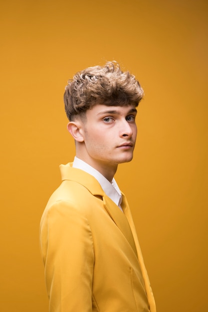 Portrait of a young man in a yellow scene