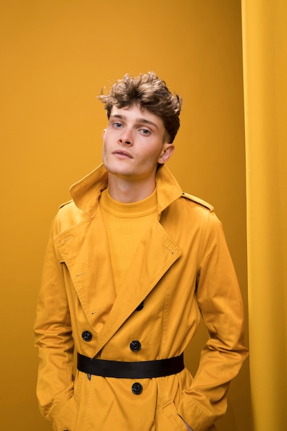 Free photo portrait of a young man in a yellow scene