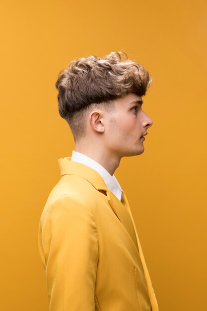 Portrait of a young man in a yellow scene