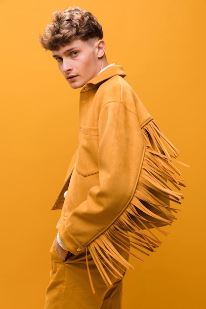 Portrait of young man in a yellow scene