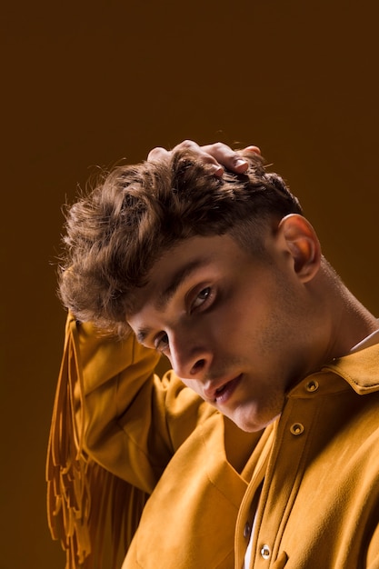 Portrait of young man in a yellow scene