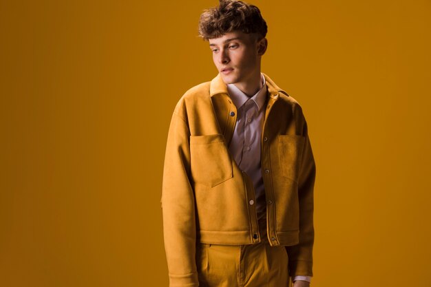 Portrait of young man in a yellow scene