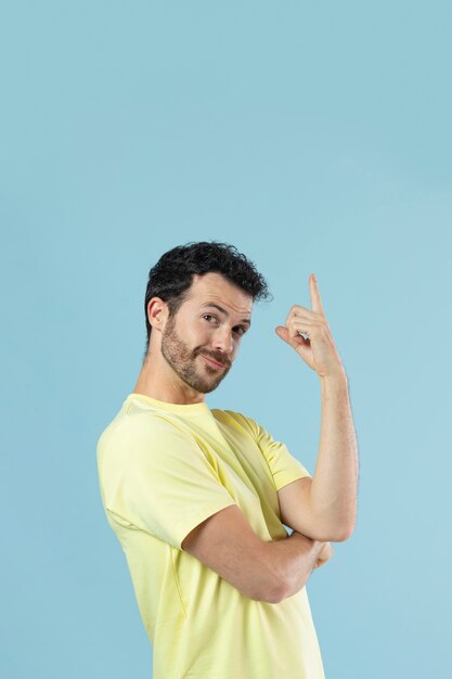 Portrait of young man in a yellow shirt