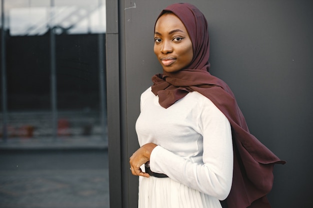 Portrait of young muslim woman wearing hijab looking at camera