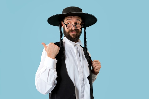 Portrait of a young orthodox jewish man at festival Purim. Holiday, celebration, judaism, tradition, religion concept.