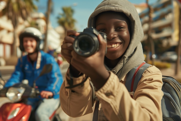 Free Photo portrait of young person celebrating world photography day with camera device