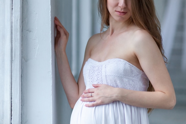 Portrait of the young pregnant woman