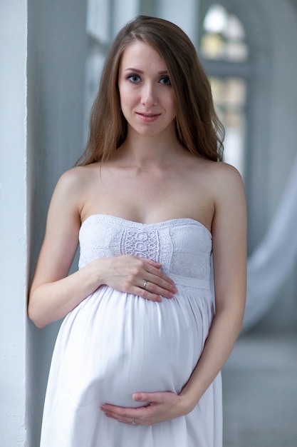 Portrait of the young pregnant woman