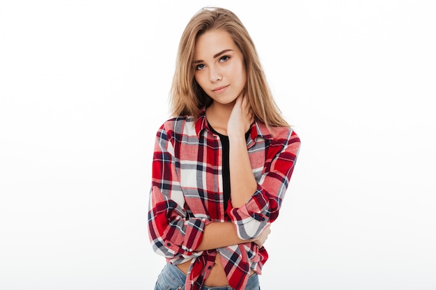 Portrait of a young pretty girl in plaid shirt