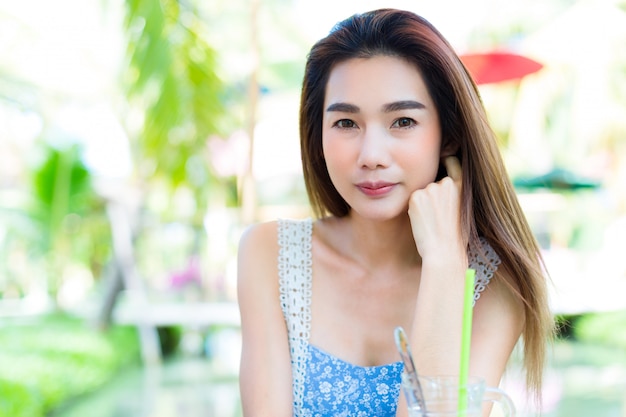 Portrait young pretty woman in park