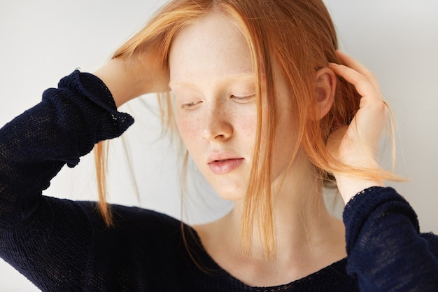 Free Photo portrait of young red-haired woman posing