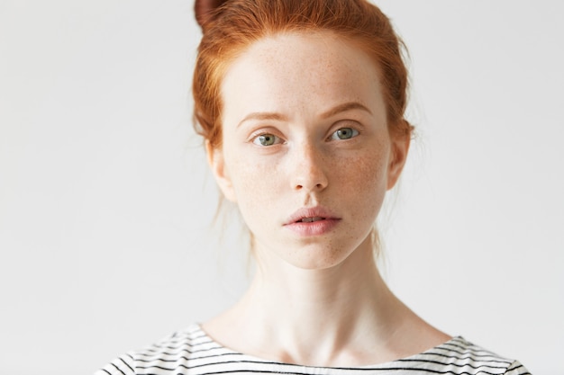 Portrait of young red-haired woman