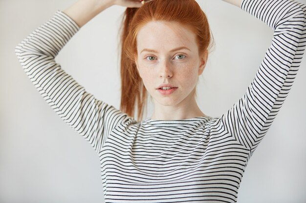 Portrait of young red-haired woman