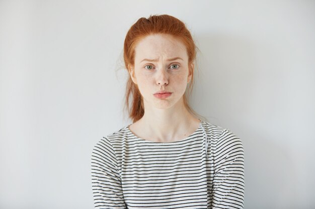 Portrait of young red-haired woman