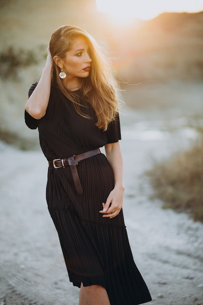 Free Photo portrait of a young sensual woman on a sunset