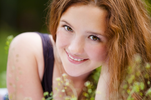 Free Photo portrait of young smiling redhaired girl