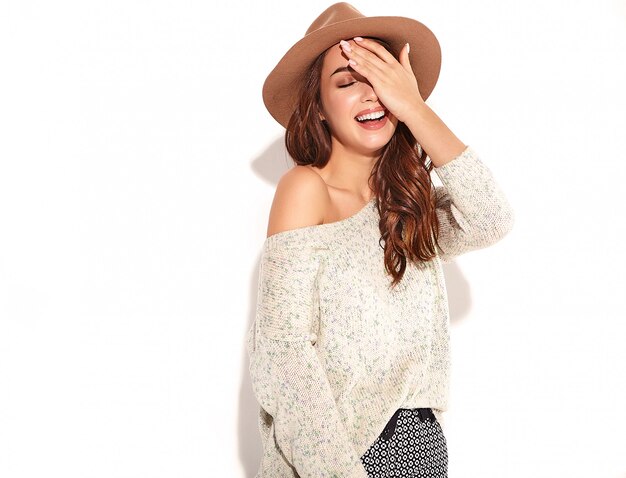 Portrait of young stylish girl model in casual summer clothes in brown hat with natural makeup isolated.