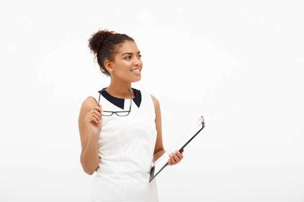 Portrait of young successful african business lady on white