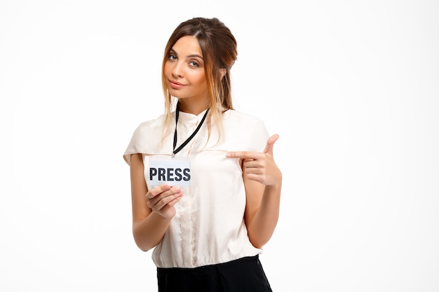 Free photo portrait of young successful businesswoman over white background.