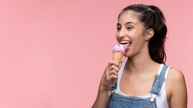 Portrait of young teenage girl eating an ice cream