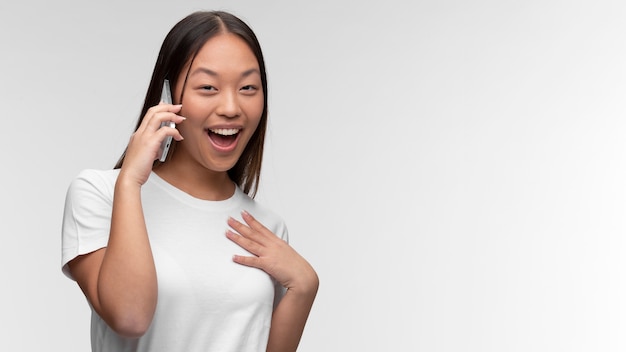 Portrait of young teenage girl talking on the phone