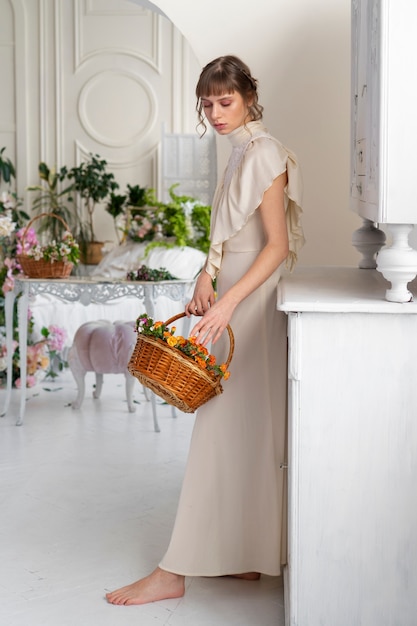 Free Photo portrait of young woman in boho dress with romantic garden aesthetic and vegetation