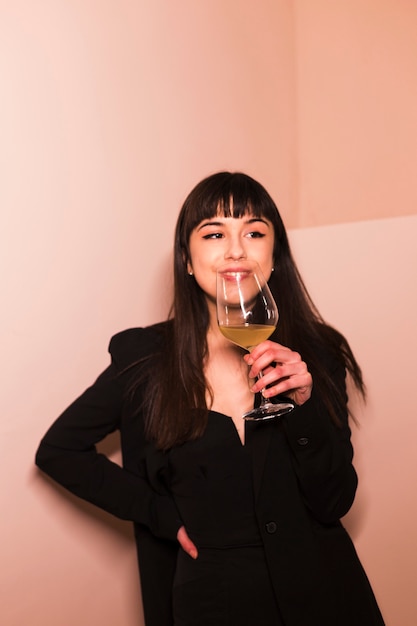 Portrait of a young woman enjoying drink