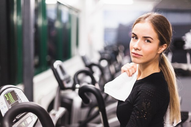 Portrait of a young woman in fitness center