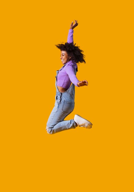 Portrait young woman jumping