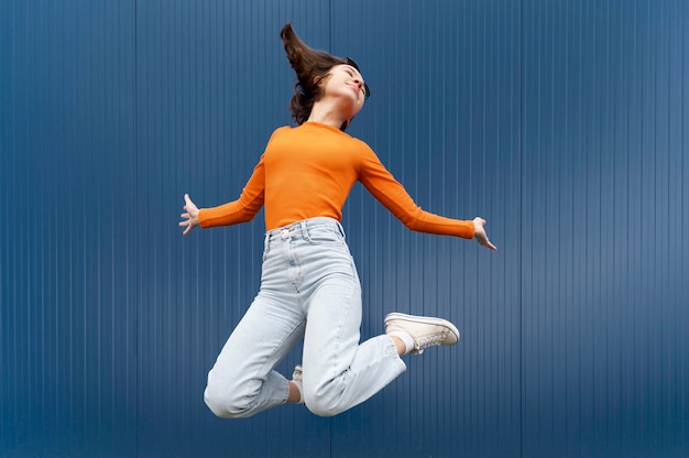 Portrait young woman jumping