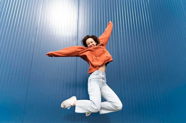 Free photo portrait young woman jumping