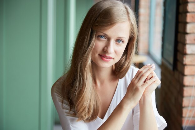 Portrait of young woman looking at camera