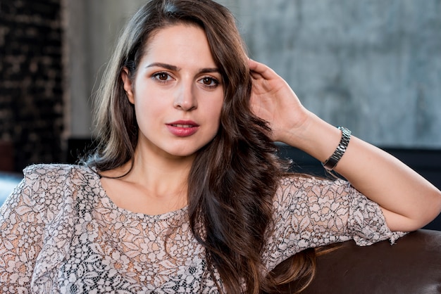 Portrait of a young woman looking at camera