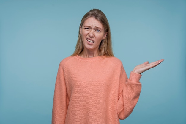 Portrait of a young woman looking confused