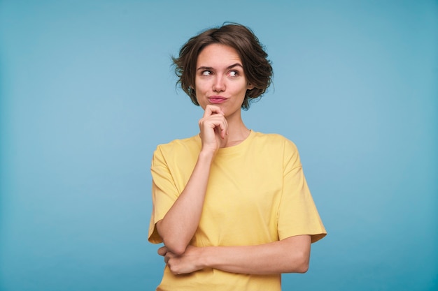 Portrait of a young woman looking mischievous