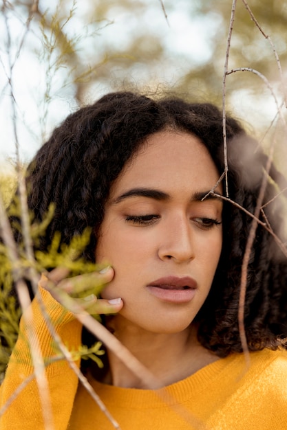 Portrait of young woman in nature