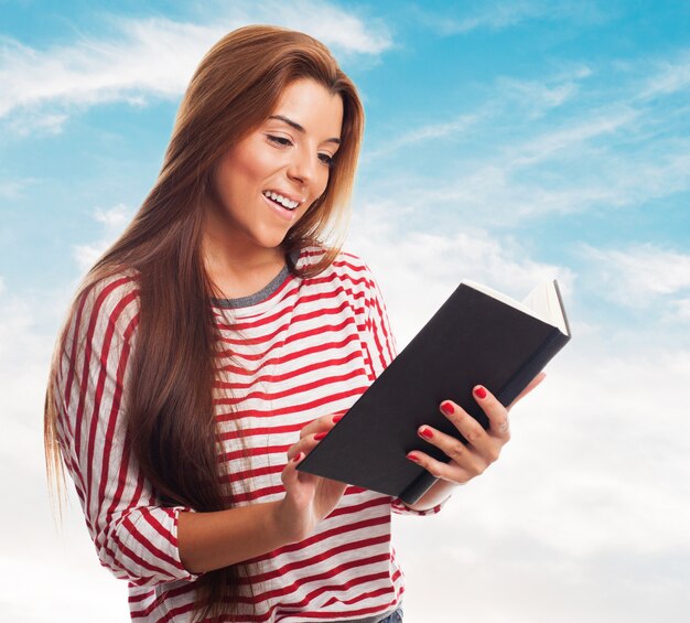 portrait of young woman reading a book