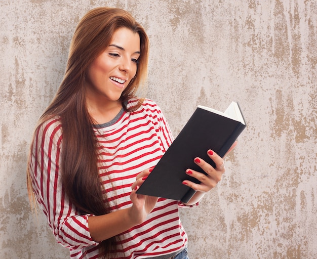 portrait of young woman reading a book