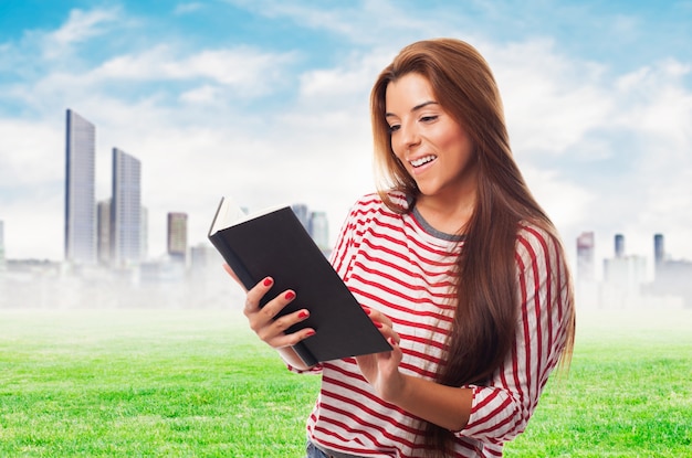 portrait of young woman reading a book