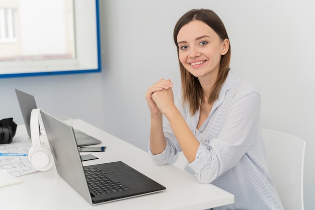 Portrait of young woman scientist at her laptop