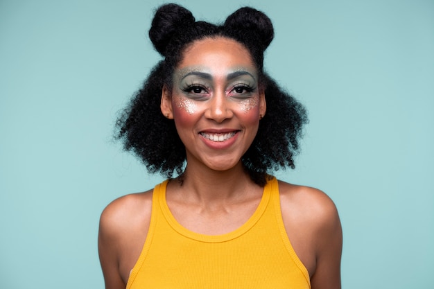 Portrait of a young woman smiling and wearing make-up