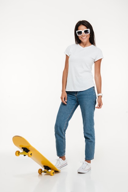 Portrait of a young woman in sunglasses posing